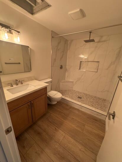 A photo of a restored bathroom after water damage restoration is completed