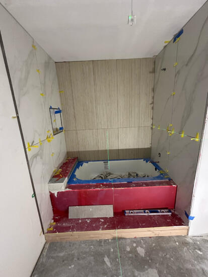 A photo of a bathtub installation