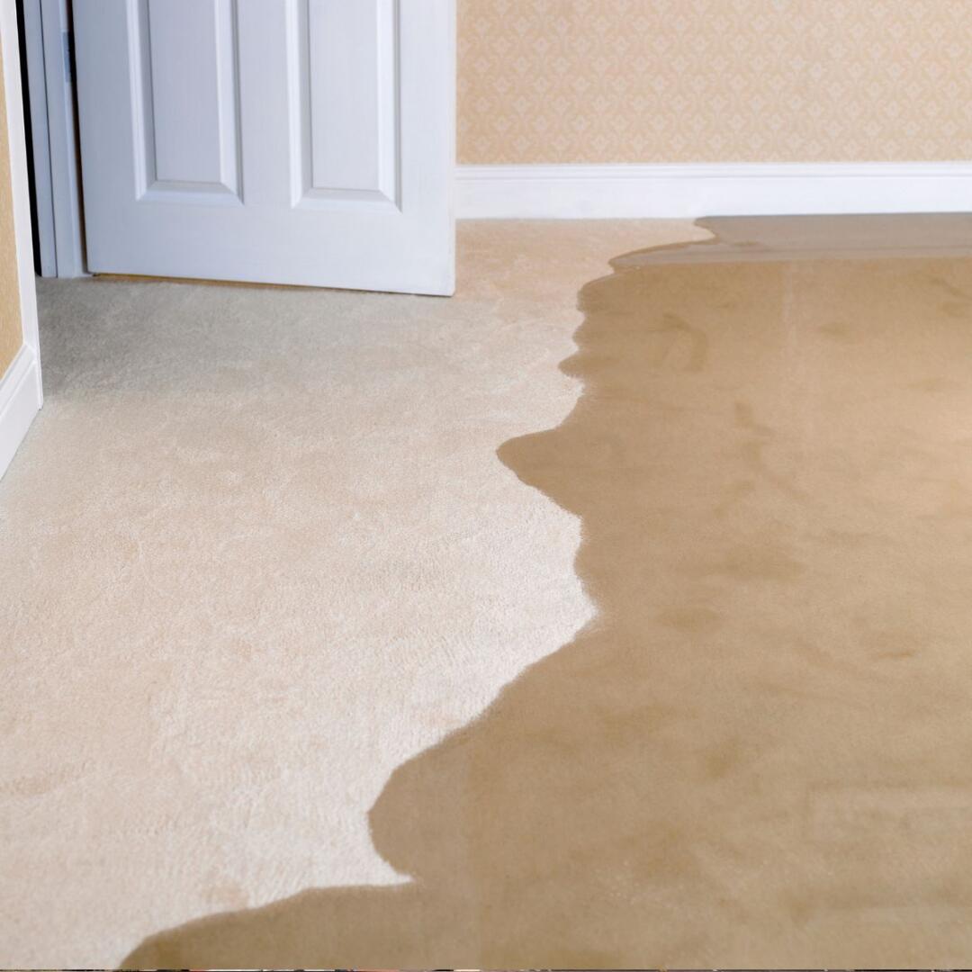 flooding water spreads quickly into a living room and causing water damage.