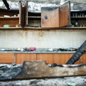 A kitchen is damaged by fire after a cooking accident.